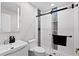 Modern bathroom featuring a glass enclosed shower with rain shower head and mosaic tile at 556 Johns Pass Ave, Madeira Beach, FL 33708