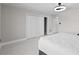 Bedroom featuring a closet with white doors and a ceiling fan at 556 Johns Pass Ave, Madeira Beach, FL 33708