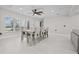 The large dining area features bright light from the window and seamlessly connects to other living spaces at 556 Johns Pass Ave, Madeira Beach, FL 33708