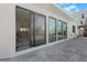 Home exterior featuring large glass doors offering a view of the pool and dining area at 556 Johns Pass Ave, Madeira Beach, FL 33708
