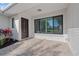 The front entrance features a brick-paved sitting area and an impressive, secure front door at 556 Johns Pass Ave, Madeira Beach, FL 33708