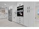 Modern kitchen with stainless steel appliances and white cabinetry at 556 Johns Pass Ave, Madeira Beach, FL 33708