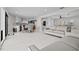 Open concept living space with updated kitchen, modern furniture, and neutral color palette at 556 Johns Pass Ave, Madeira Beach, FL 33708