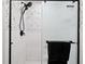 Shower featuring rainfall shower head, handheld shower head, black fixtures and black towel rack at 556 Johns Pass Ave, Madeira Beach, FL 33708