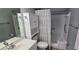 Bathroom with walk-in tub, gray walls, modern sink and towel holder at 5725 80Th N St # 107, St Petersburg, FL 33709