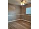 Bedroom featuring new wood-look floors and closet with bi-fold doors at 5725 80Th N St # 107, St Petersburg, FL 33709