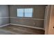 Bedroom featuring new wood-look floors and closet with bi-fold doors at 5725 80Th N St # 107, St Petersburg, FL 33709