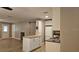 Open kitchen featuring white cabinets, butcher block island, and stainless steel appliances at 5725 80Th N St # 107, St Petersburg, FL 33709