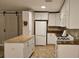 Updated kitchen showcasing white cabinets, granite countertops, and modern appliances at 5725 80Th N St # 107, St Petersburg, FL 33709