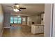 Spacious living room featuring tile floors, ceiling fans, and abundant natural light at 5725 80Th N St # 107, St Petersburg, FL 33709