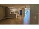 Bright living space with tile floors, open layout, and updated kitchen with a breakfast bar at 5725 80Th N St # 107, St Petersburg, FL 33709