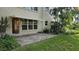 Brick patio with view of the building and grass at 5725 80Th N St # 107, St Petersburg, FL 33709