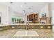 Kitchen sink features granite countertops and stainless steel faucet at 601 Viento De Avila, Tampa, FL 33613