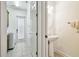 Laundry room and powder room with a pedestal sink, and a door leading to the exterior at 601 Viento De Avila, Tampa, FL 33613