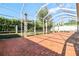 Large screened patio with brick flooring provides outdoor living space at 601 Viento De Avila, Tampa, FL 33613