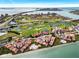 Scenic aerial view of a golf course and residential buildings along the water at 6140 Sun Blvd # 7, St Petersburg, FL 33715