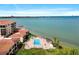 Beautiful aerial view of a community pool with waterfront access and city views at 6140 Sun Blvd # 7, St Petersburg, FL 33715