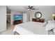 Cozy bedroom with a comfortable bed, dresser, and round mirror for a relaxing retreat at 6140 Sun Blvd # 7, St Petersburg, FL 33715