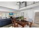 Open dining room with view to living room, TV, and staircase at 6140 Sun Blvd # 7, St Petersburg, FL 33715
