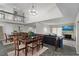 Open dining room with table, chairs, and living room in view with fireplace at 6140 Sun Blvd # 7, St Petersburg, FL 33715