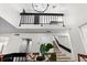 Dining room showcasing modern chandelier, upper level railing, and staircase at 6140 Sun Blvd # 7, St Petersburg, FL 33715