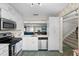 Kitchen with stainless steel appliances and ample cabinet storage, open to living area at 6140 Sun Blvd # 7, St Petersburg, FL 33715