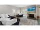 Cozy living room with a decorative fireplace, comfortable seating, and a serene atmosphere at 6140 Sun Blvd # 7, St Petersburg, FL 33715
