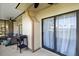 Covered patio area with BBQ grill and sliding glass doors offering views of the neighborhood at 6140 Sun Blvd # 7, St Petersburg, FL 33715