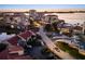Aerial view of a neighborhood street lined with townhouses and condominiums near the water at 6140 Sun Blvd # 7, St Petersburg, FL 33715