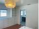 Bright bedroom showing built-in drawers and shelves, and entrance to bathroom with stylish patterned tile at 6727 Burlington N Ave, St Petersburg, FL 33710