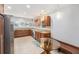 Updated kitchen boasts stainless steel appliances, granite countertops, a breakfast nook, and custom cabinets at 6727 Burlington N Ave, St Petersburg, FL 33710