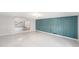 Spacious living room with tile floors and a decorative accent wall at 6727 Burlington N Ave, St Petersburg, FL 33710