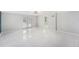 Bright living room with tile flooring and glass doors to the outdoor space at 6727 Burlington N Ave, St Petersburg, FL 33710