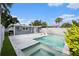Backyard pool and patio area include the pool, jacuzzi, lounge chairs, and exterior entrance at 6727 Burlington N Ave, St Petersburg, FL 33710