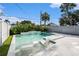 Backyard pool and patio area including in-pool seating and lush landscaping at 6727 Burlington N Ave, St Petersburg, FL 33710
