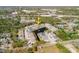 A high aerial shows the home near a highway with a pond and other homes nearby at 6732 Rocky Park St, Tampa, FL 33625