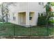 Fenced backyard with a covered patio and well-maintained lawn and mature landscaping at 6732 Rocky Park St, Tampa, FL 33625