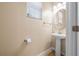 Bright half bath with a modern pedestal sink and round mirror at 6732 Rocky Park St, Tampa, FL 33625