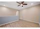 Spacious room with wood-look floors and natural light from multiple directions at 6732 Rocky Park St, Tampa, FL 33625