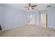 A large bedroom with a ceiling fan and access to the bathroom and closet at 6732 Rocky Park St, Tampa, FL 33625