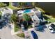 Overhead aerial view of the community pool and amenities located next to a pond at 6732 Rocky Park St, Tampa, FL 33625