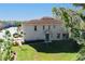 Side view of a well-maintained two-story home with a lush green lawn at 6732 Rocky Park St, Tampa, FL 33625