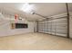 Spacious two-car garage with epoxy flooring and overhead storage racks at 6732 Rocky Park St, Tampa, FL 33625