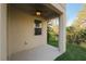 Covered patio overlooking manicured lawn and fenced backyard with mature trees at 6732 Rocky Park St, Tampa, FL 33625