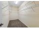 Walk-in closet with carpet and built-in shelving offering ample storage space at 6732 Rocky Park St, Tampa, FL 33625