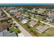 Aerial shot showcasing a waterfront community with homes, canals, and a glimpse of the open water in the distance at 7322 Mako Dr, Hudson, FL 34667