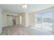 Bright bedroom boasts sleek modern barn door to bathroom and sliding glass door to pool at 7322 Mako Dr, Hudson, FL 34667
