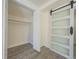 Bedroom closet features built-in shelving and a modern barn door at 7322 Mako Dr, Hudson, FL 34667