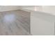 Modern kitchen island with white countertop and gray flooring at 7322 Mako Dr, Hudson, FL 34667