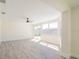 Spacious living area featuring new floors, modern ceiling fan and access to the backyard at 7322 Mako Dr, Hudson, FL 34667